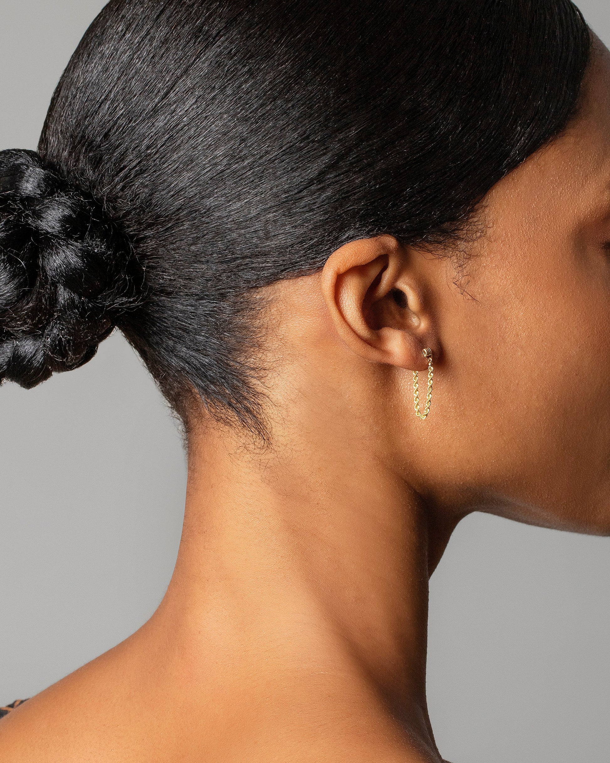 Golden Twist Stud Earring Single on model.