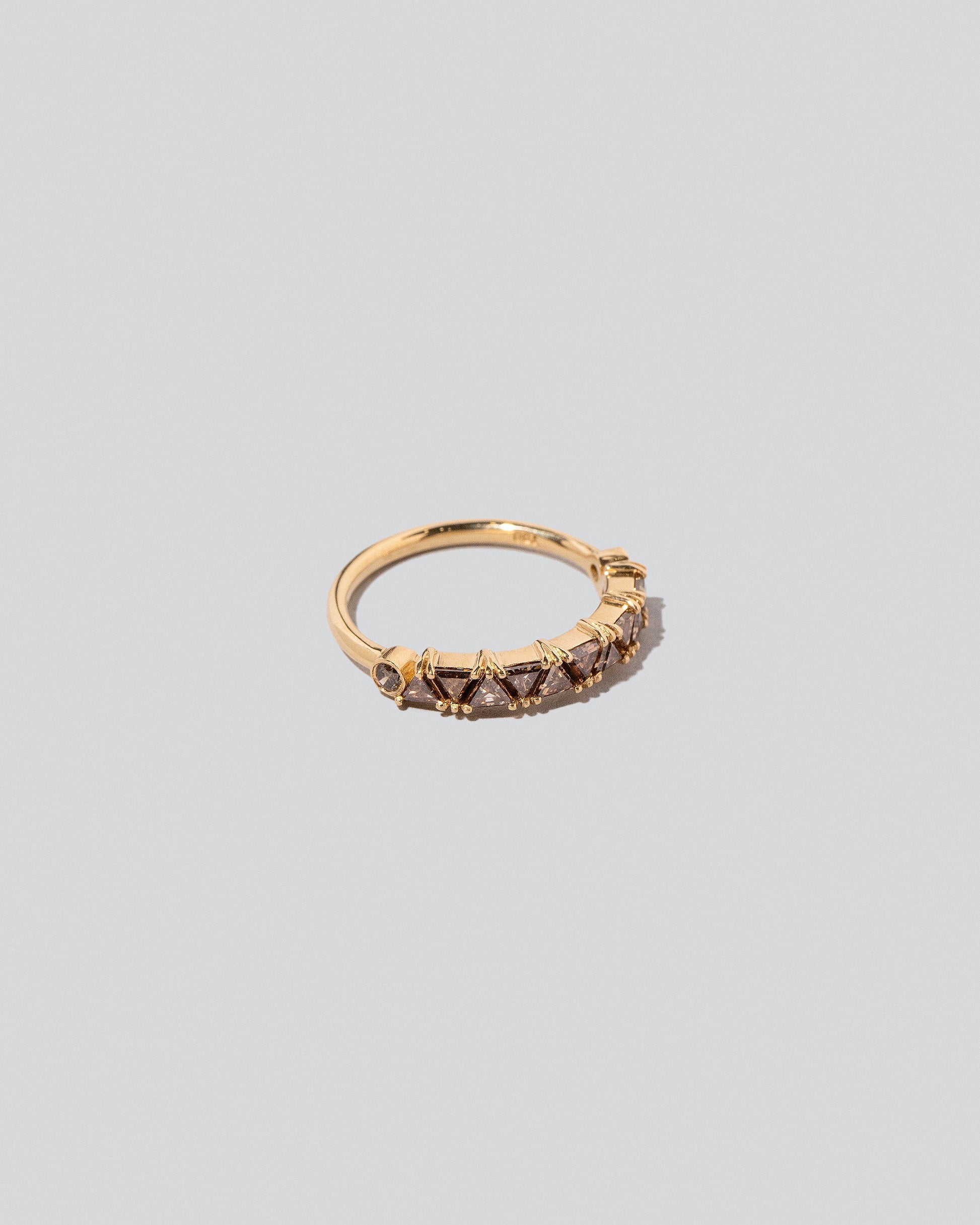 Eleven Trillion Ring - Cognac Diamonds on light color background.