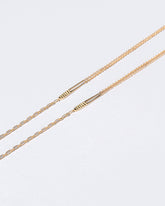 Portrait of Jean Louis Optical Chain on light color background.