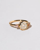 Theia Ring on light color background.