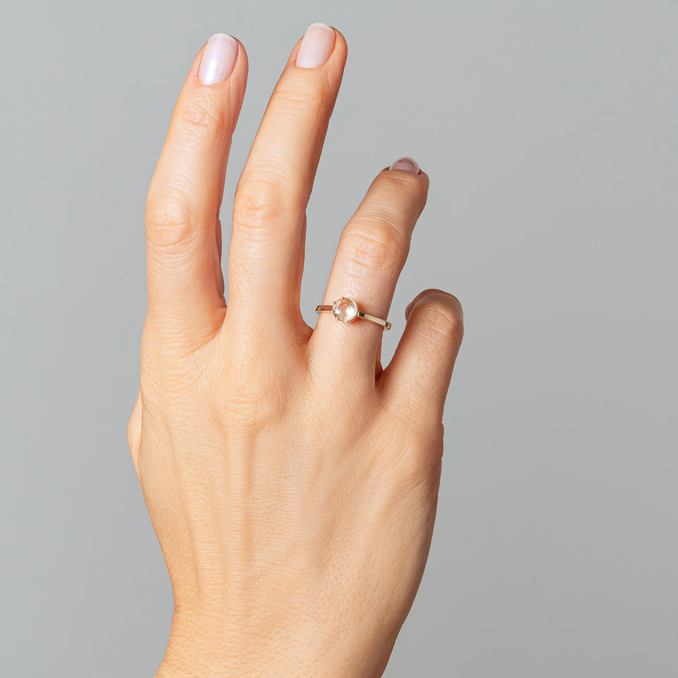 product_details::Sun & Moon Ring - Bicolor Yellow Sapphire on model.