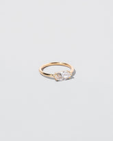 Elixer Ring on light color background.