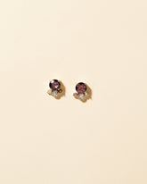 Vega Earrings - Dark Spinel on light color background.