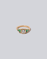 Diamond & Emerald Third Eye Ring on light colored background.