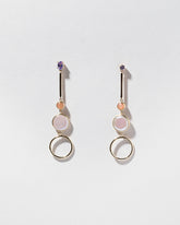 Act 3. Earrings on light color background.
