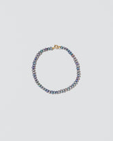 Peacock Seed Pearl Bracelet on light color background.