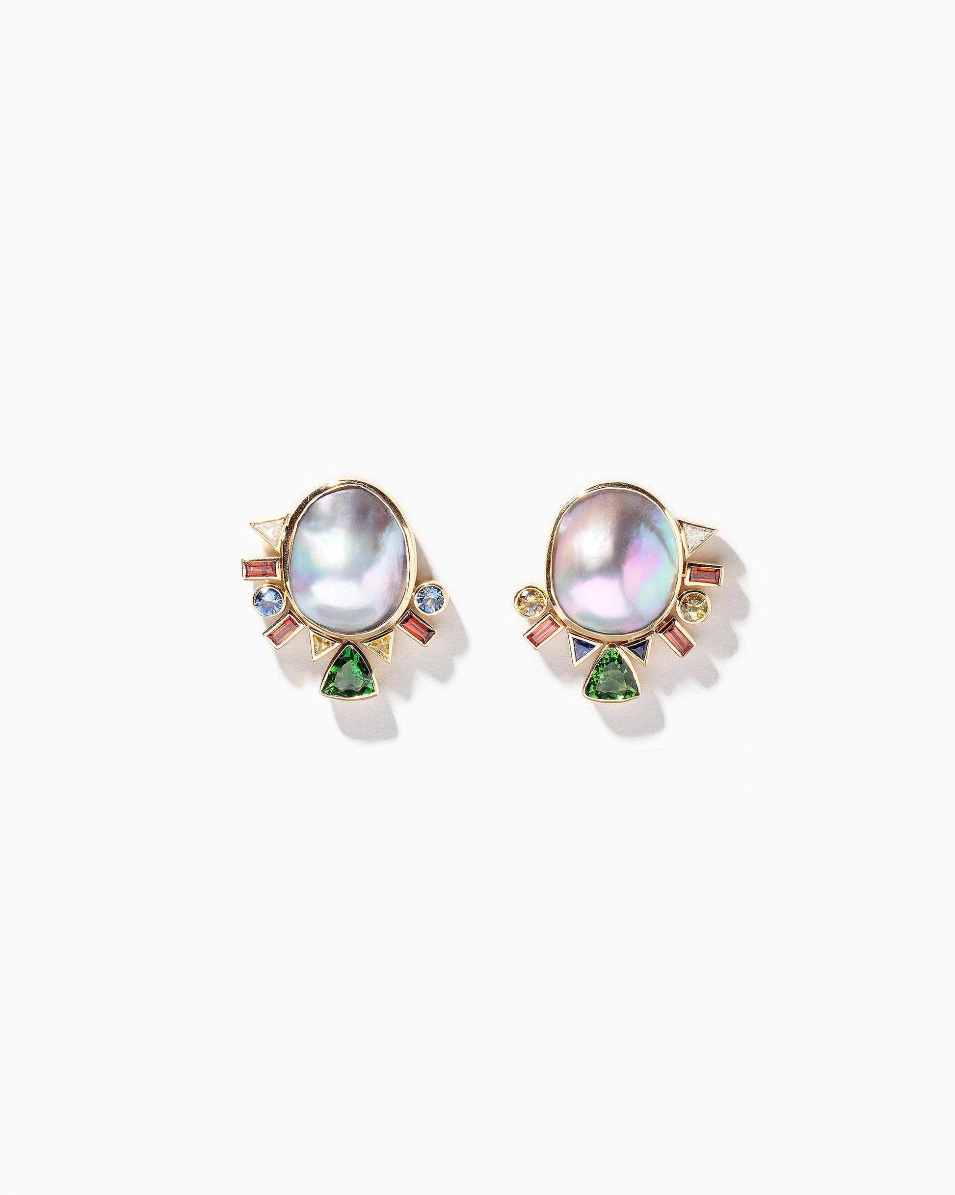 Cosmic Realm Earrings on light color background.