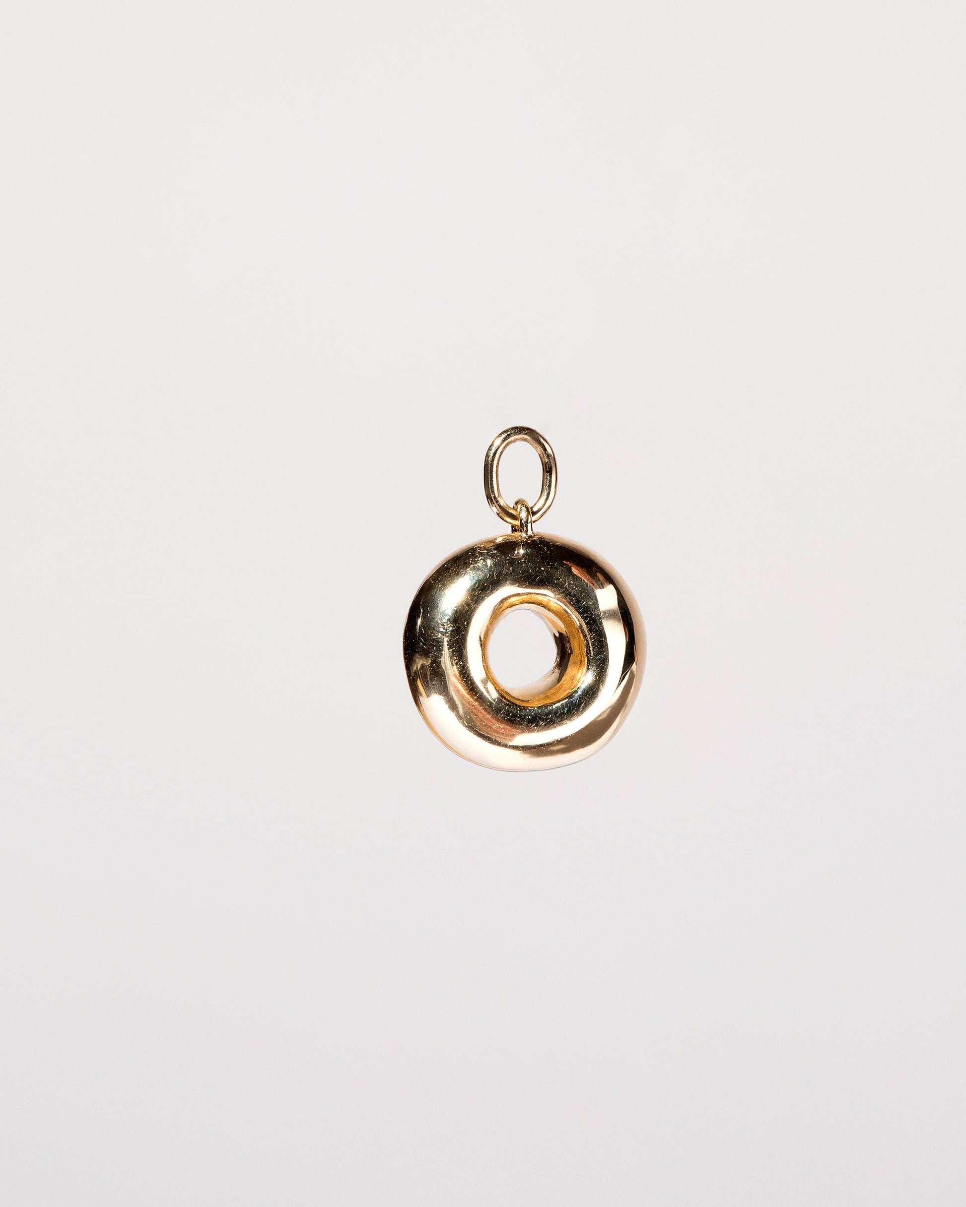 Plain Donut Charm on light color background.