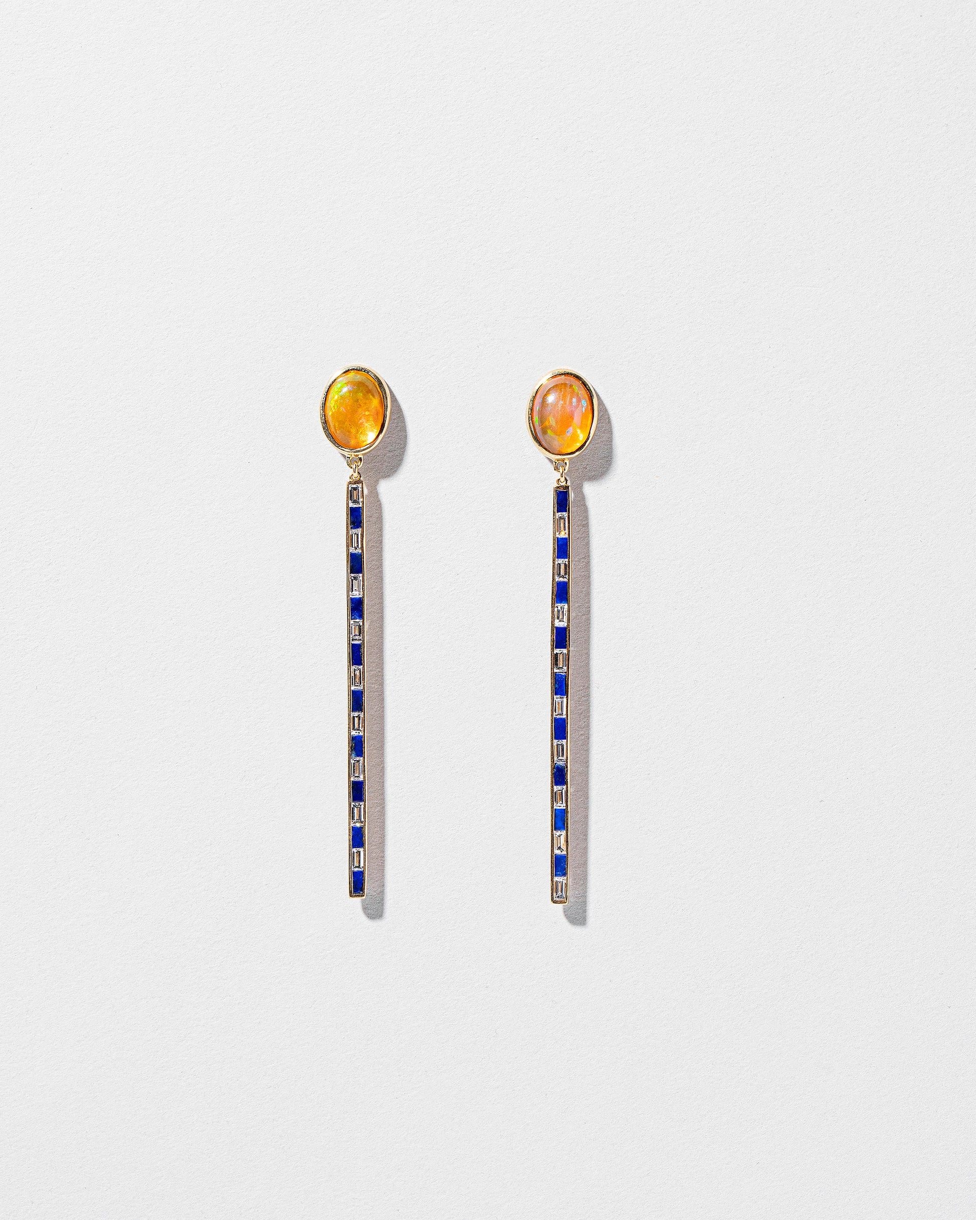 Ethiopian Opal Transformation Earrings on light color background.