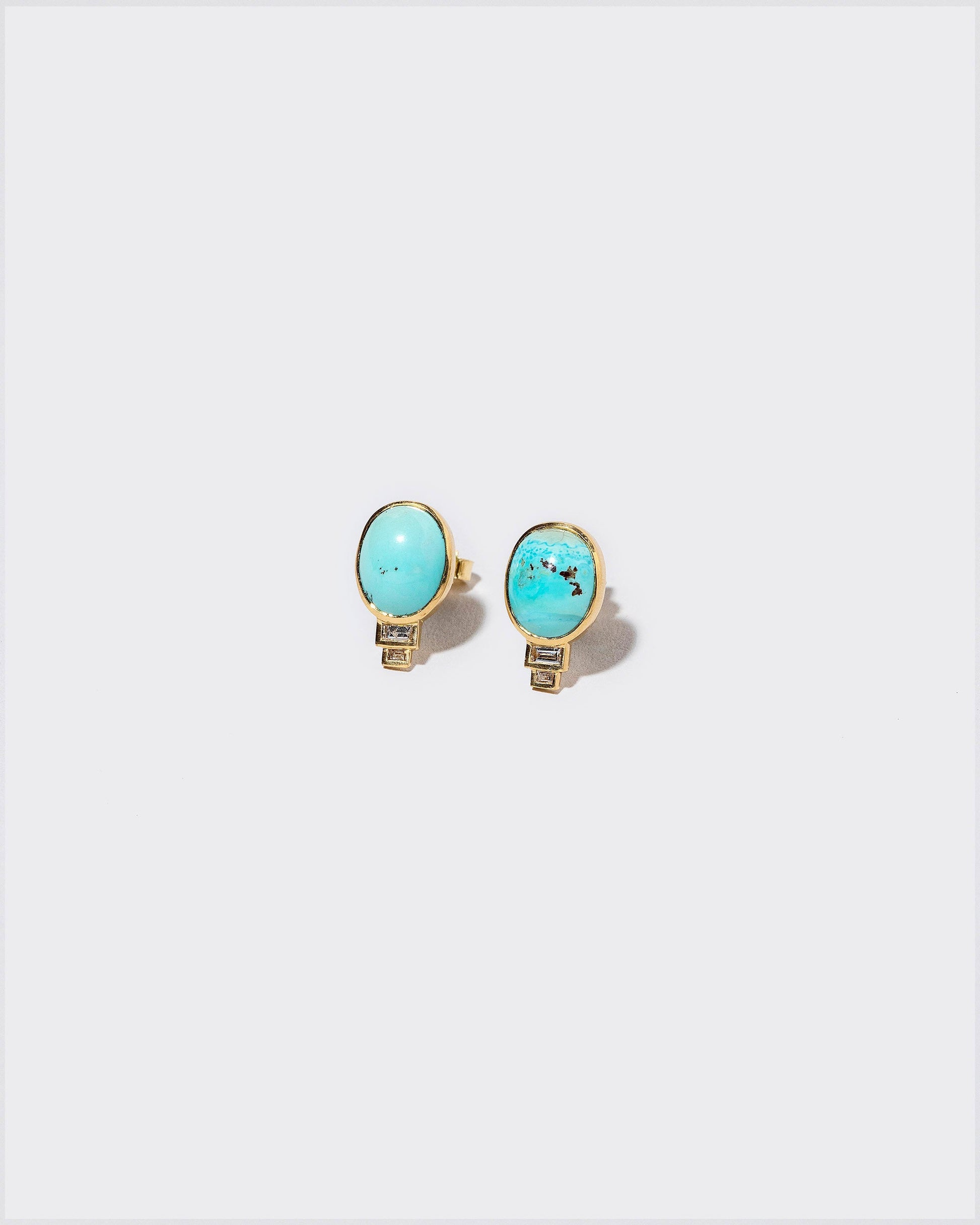 Life-Giver Earrings on light color background.