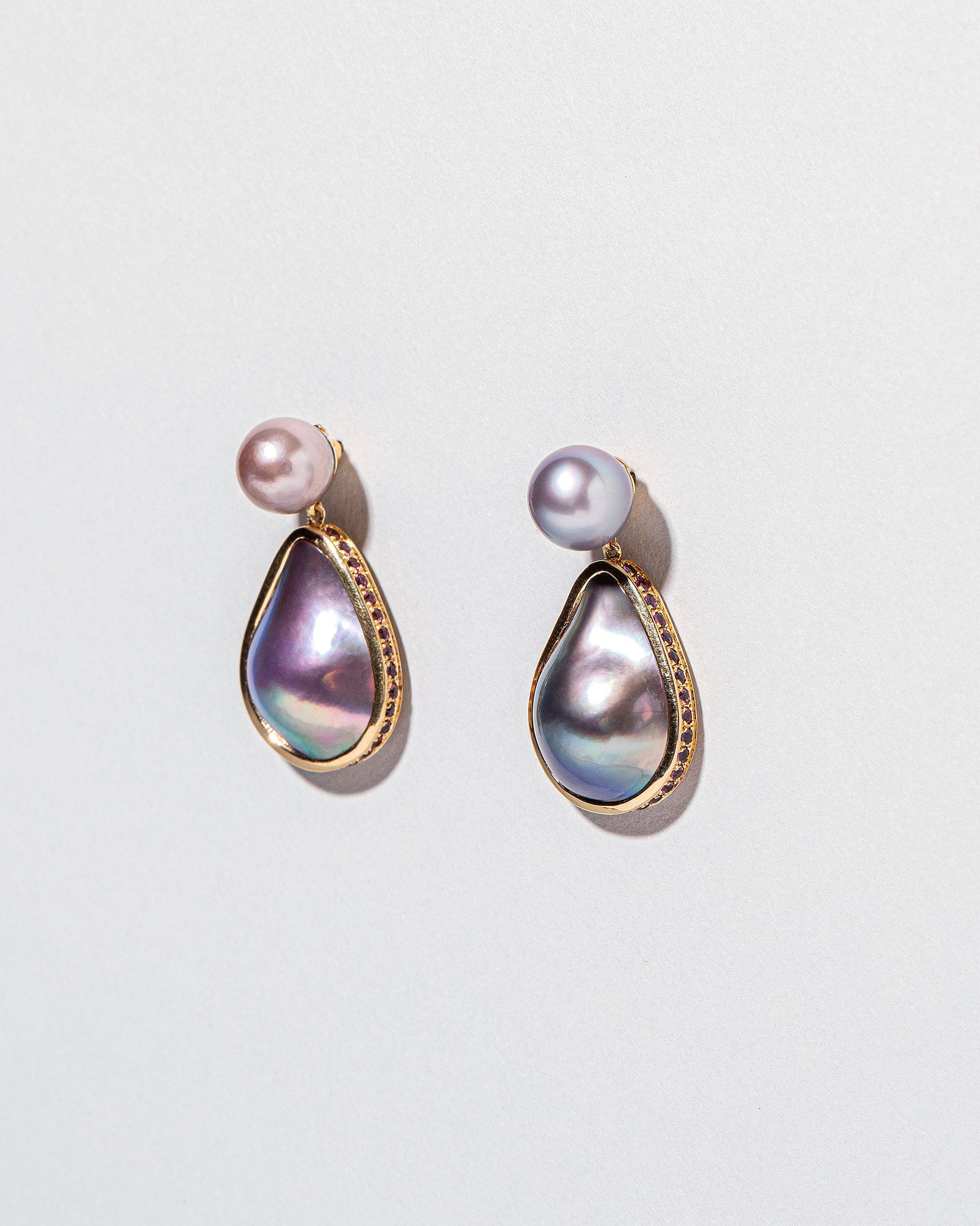 Closeup details of the Soft Landscape Earrings on light color background.