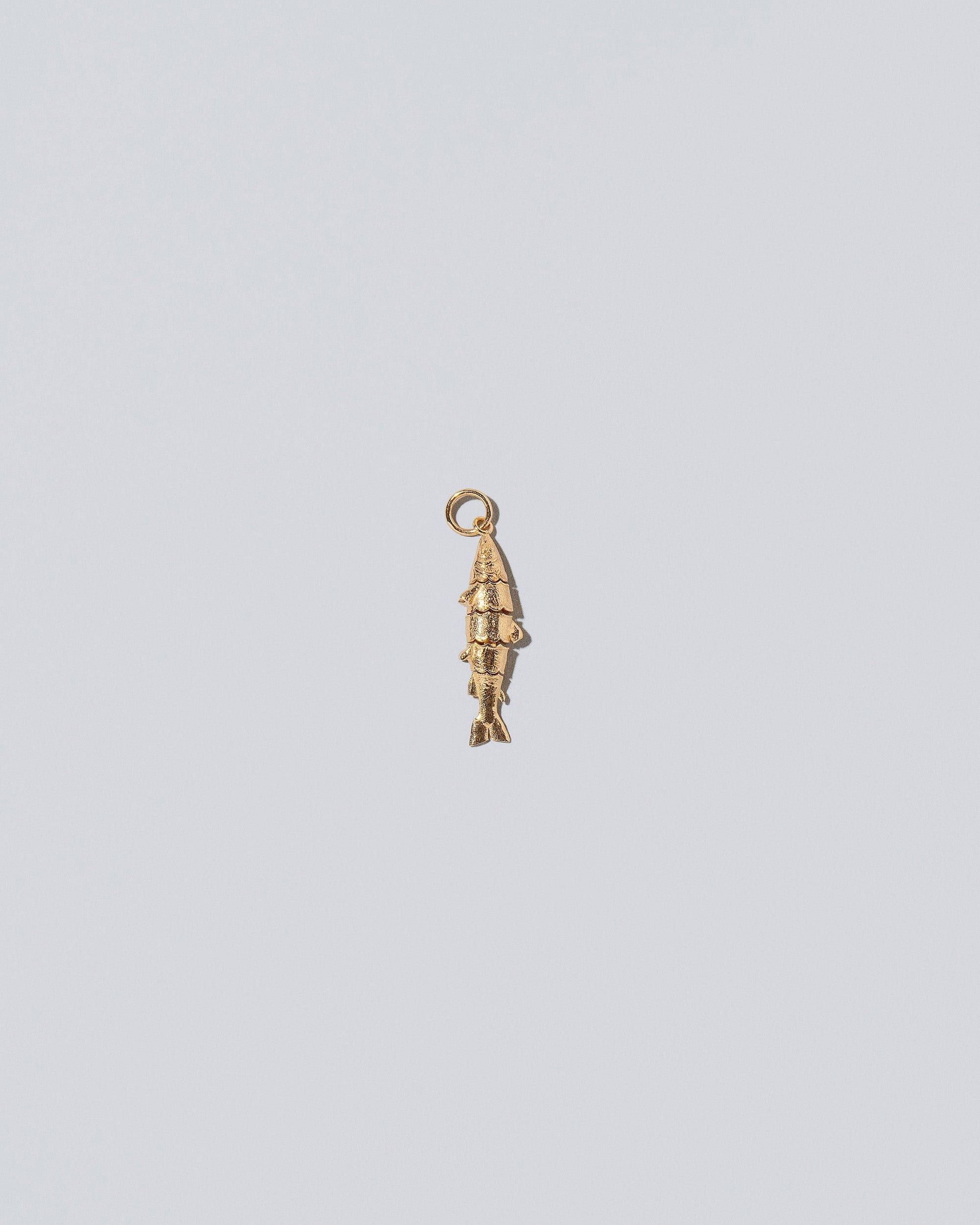 Fish Charm - Solids on light color background.