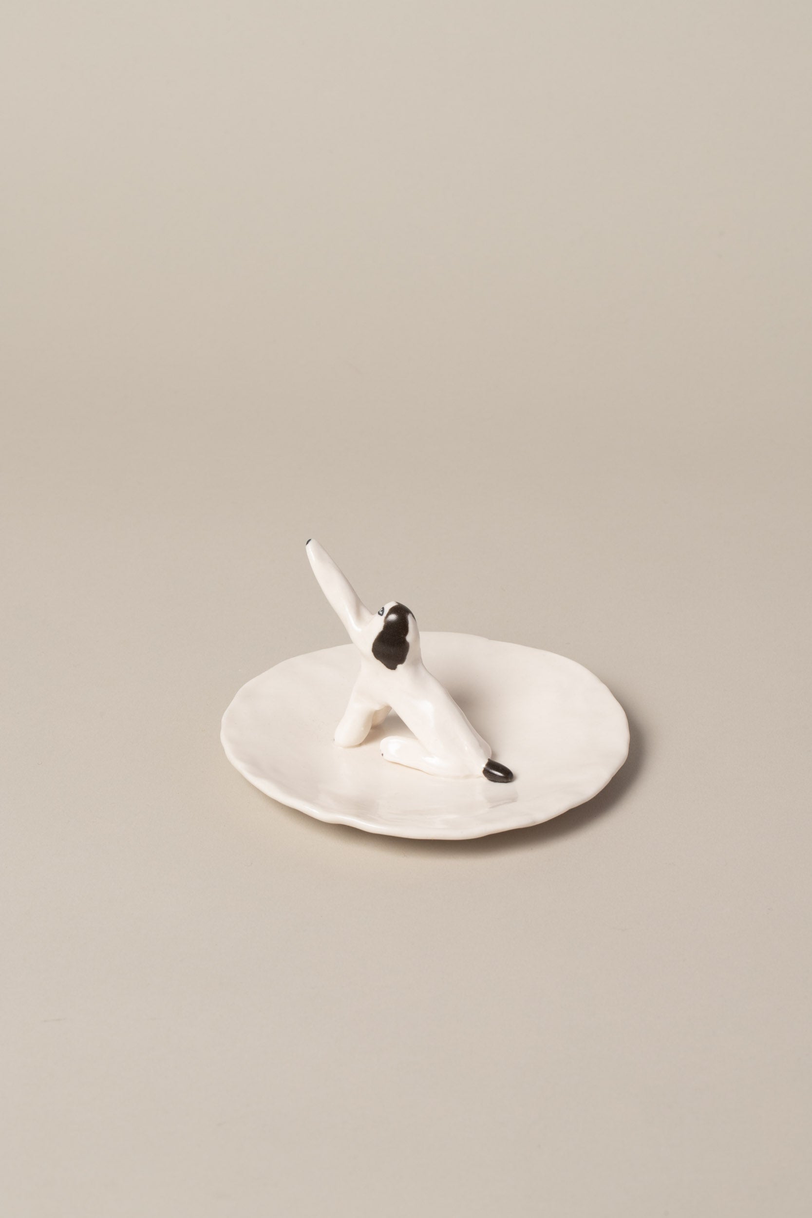 View from the back of the Eleonor Boström Dog Ring Dish on light color background.