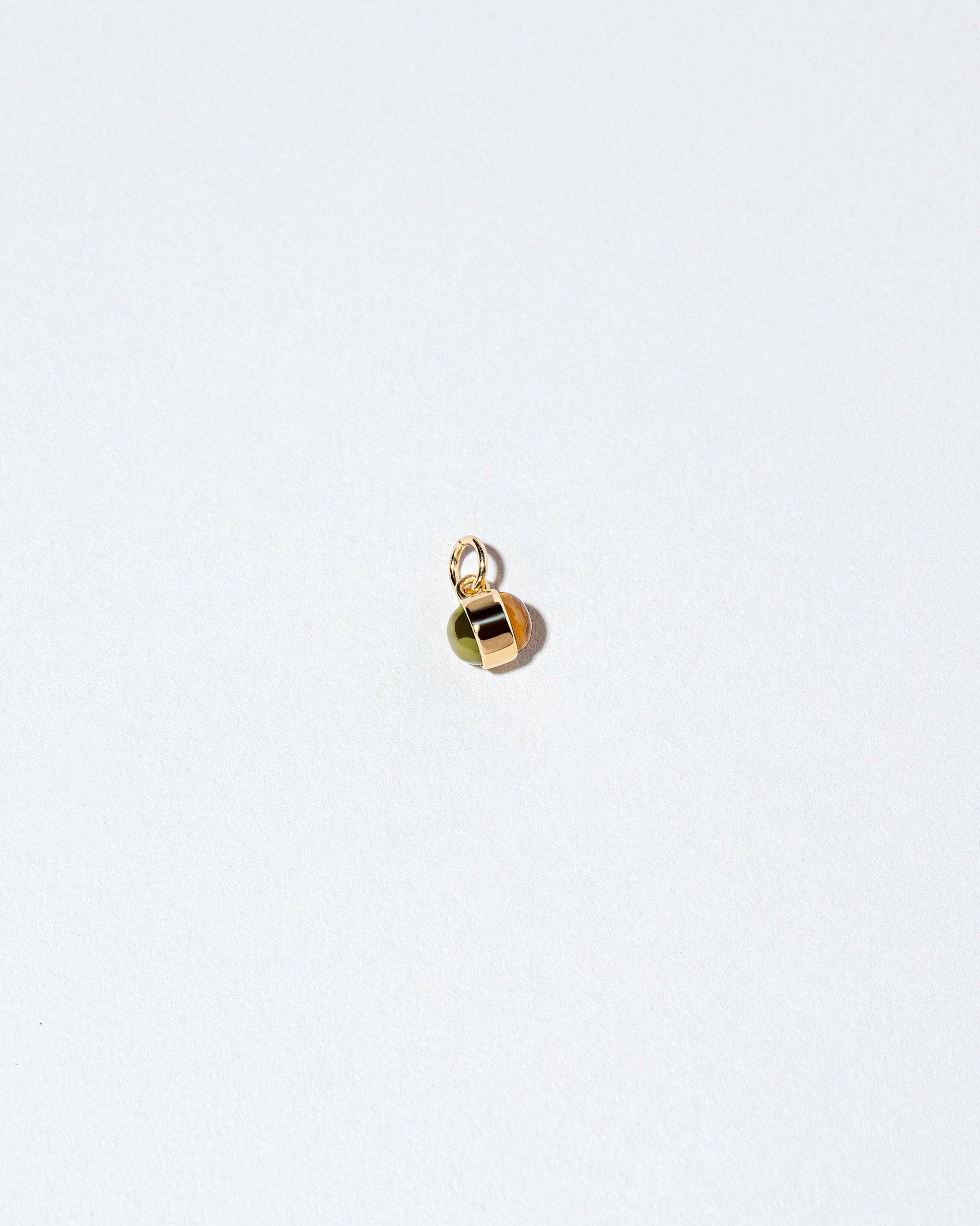 Birthstone Charm on light color background.