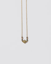 Radical Abstraction Necklace on light color background.