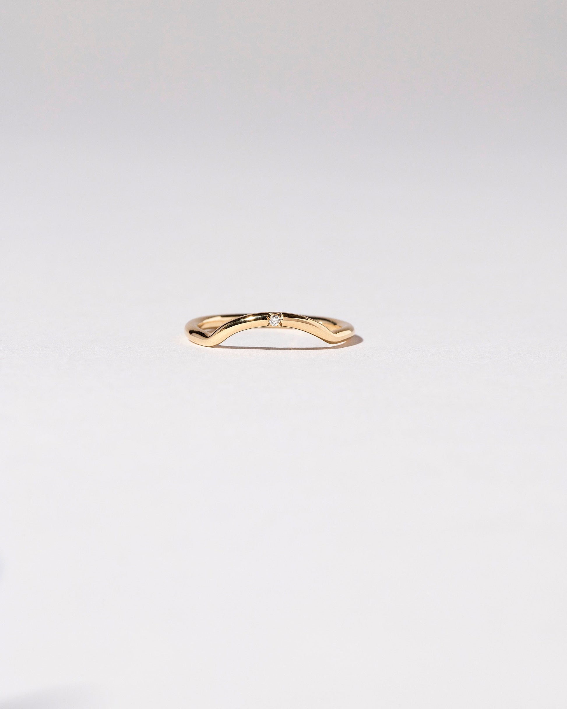 Mini Curve Band - Single Stone on light color background.