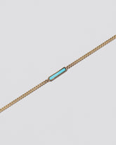 Identity Chain Necklace on light colored background.