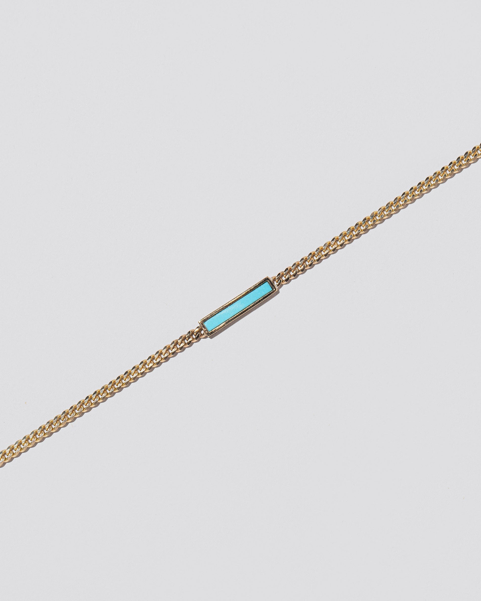 Identity Chain Necklace on light colored background.