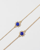 Lapis & Diamond Eye Bracelet on light color background.