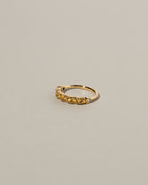 Eleven Trillion Ring - Yellow Sapphire on light color background.