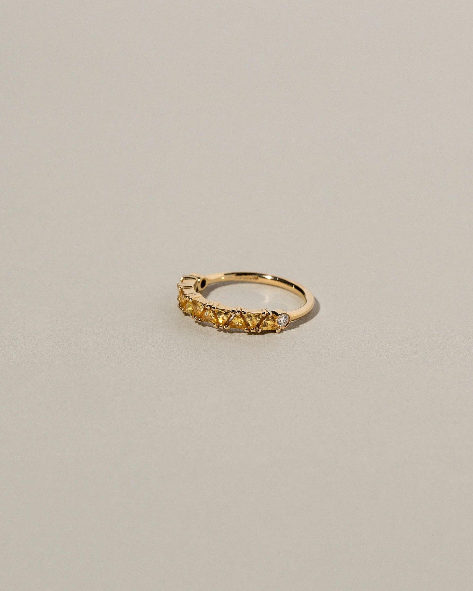 Eleven Trillion Ring - Yellow Sapphire on light color background.