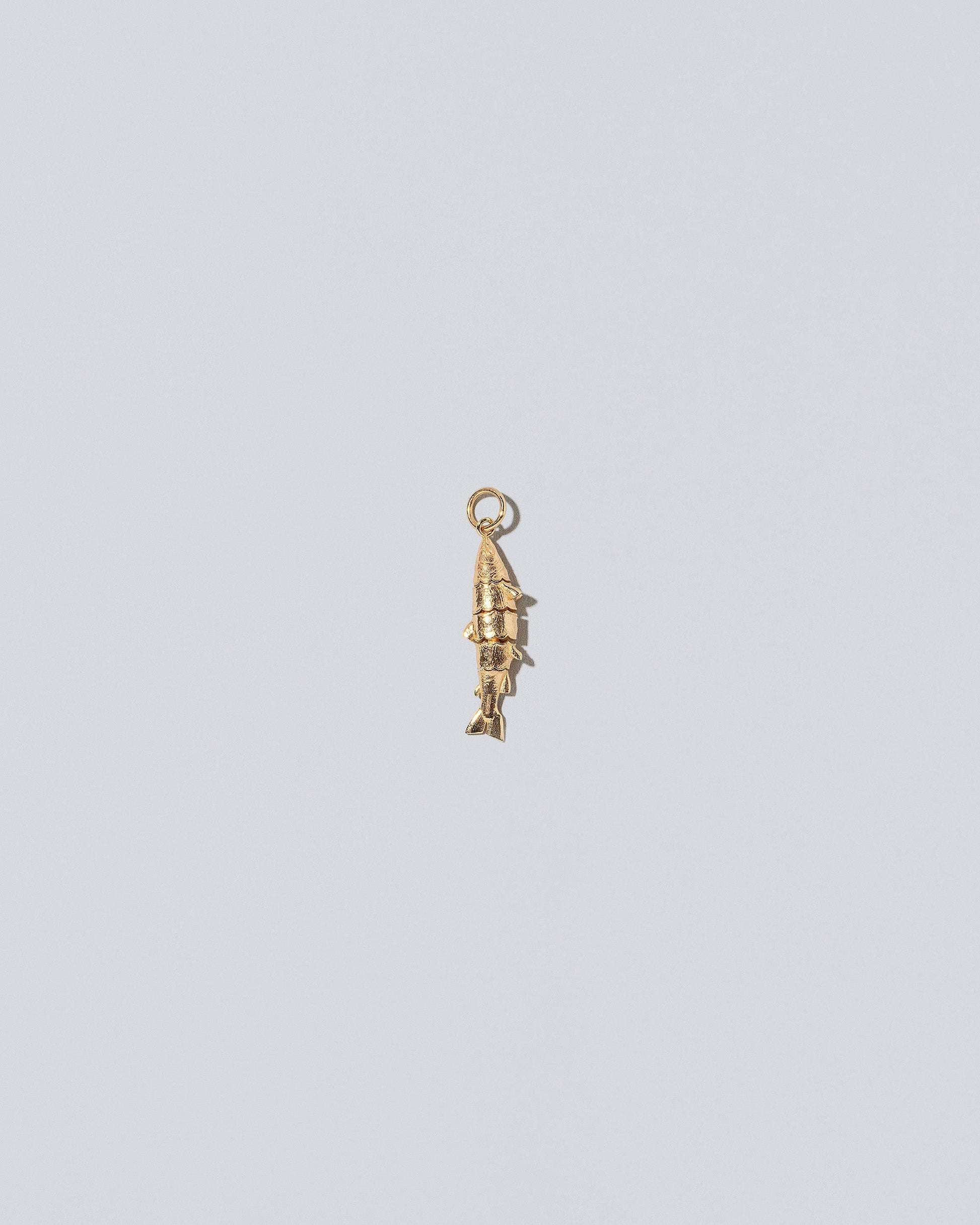 Fish Charm - Solids on light color background.
