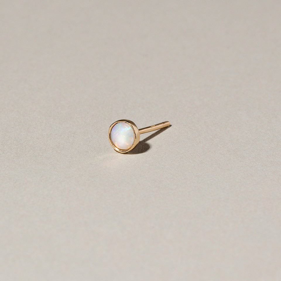 product_details:: Birthstone Single Stud on light color background.