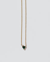 Rise Necklace on light color background.