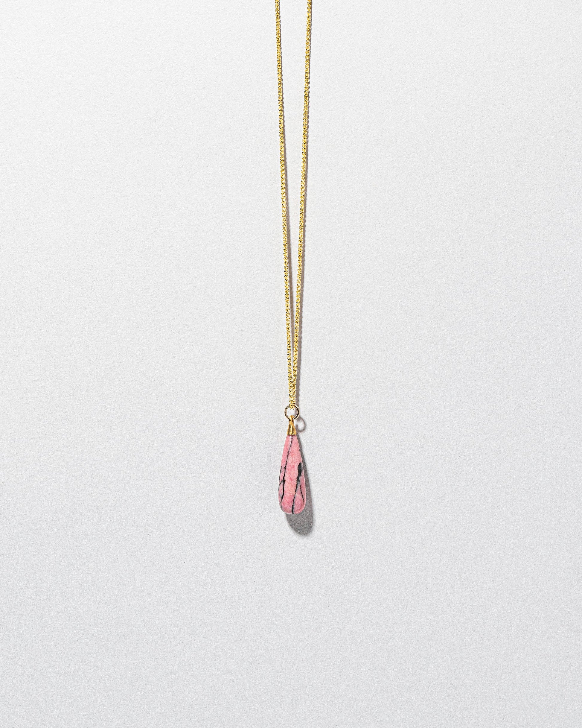 Rhodolite Drop Pendant on light color background.