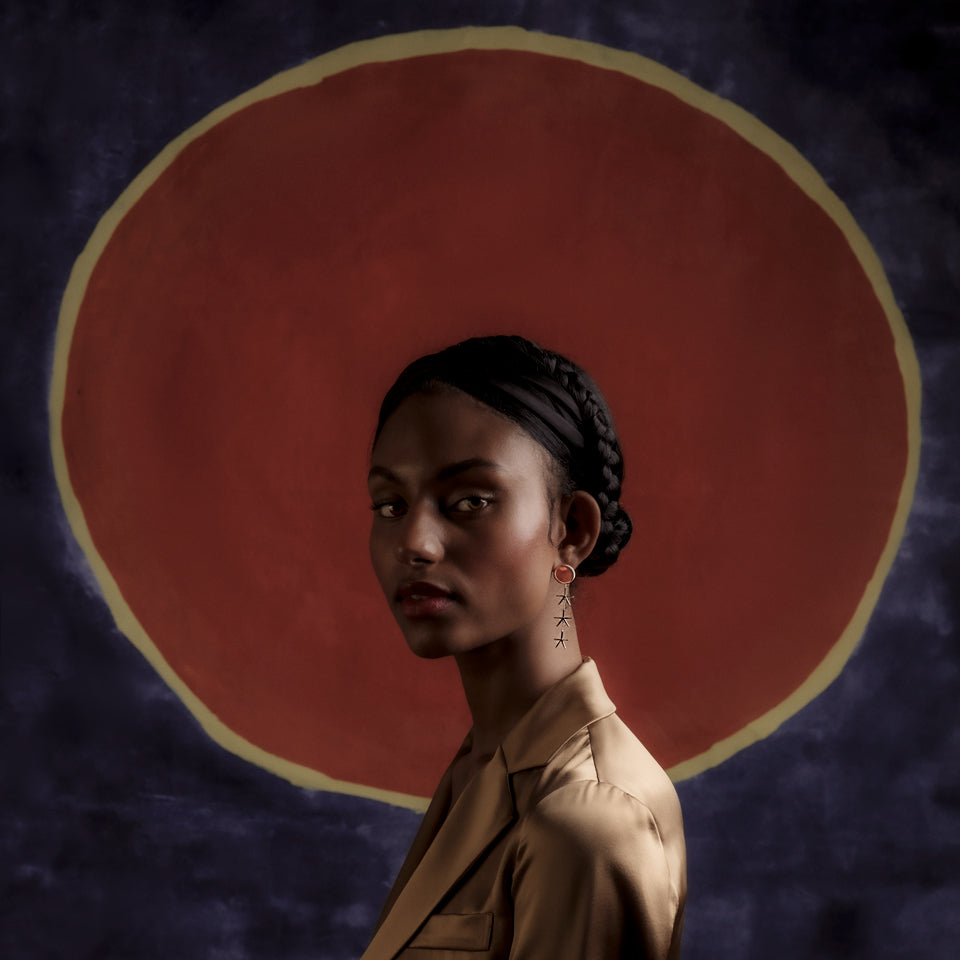 product_details::Red Sun Earrings on model.