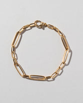 Long Loop Chain Bracelet on light color background.