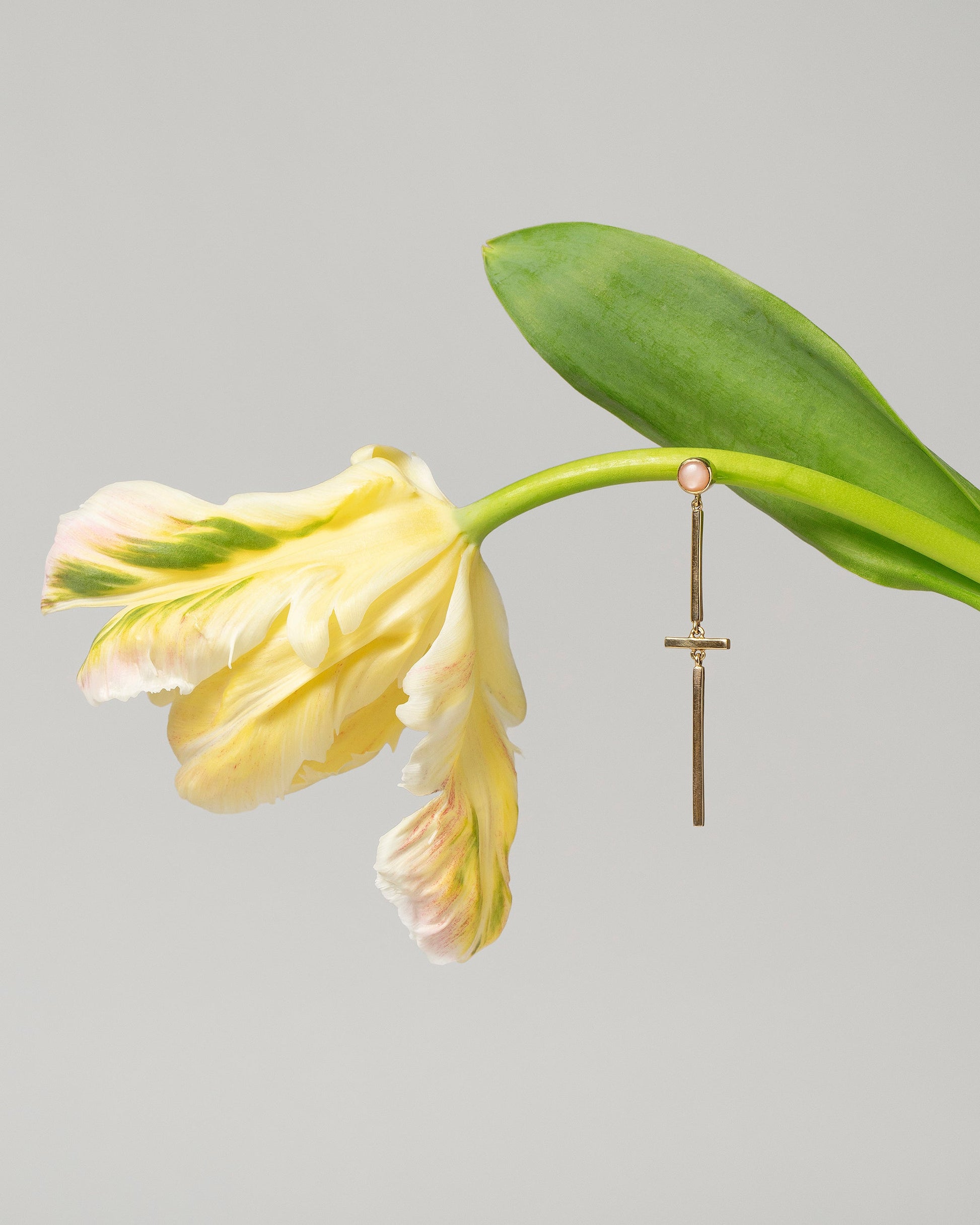 Act 2. Single Earring 3 on light color background.