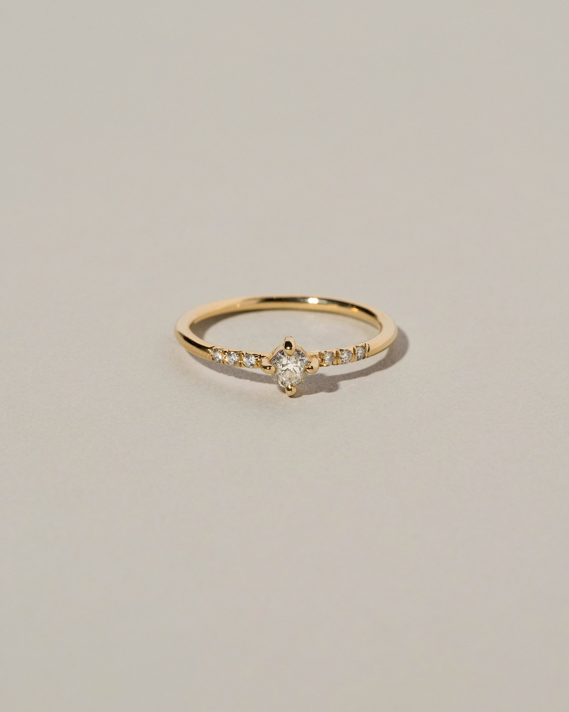 Mini Compass Rose Ring on light color background.