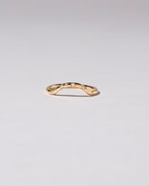 Gold Five Stone White Diamond Mini Curve Band on light color background.