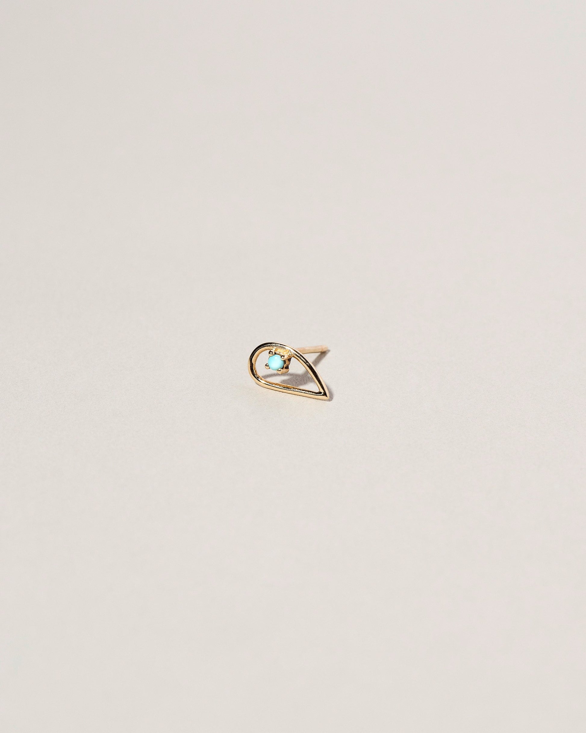 Sun Drop Single Stud on light color background.