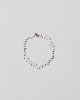Zipper Pearl Bracelet on light color background.