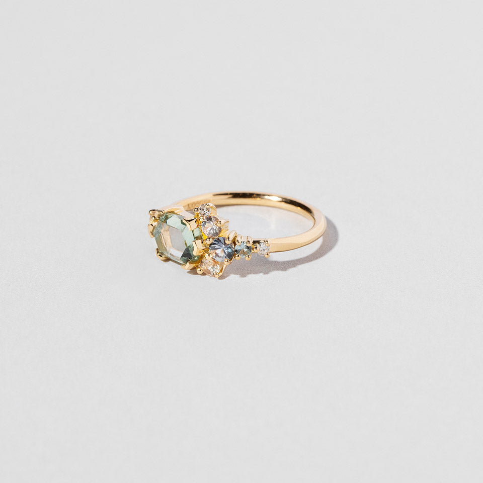 product_details:: Hexagonal Slice Sapphire Cluster Ring on light color background.