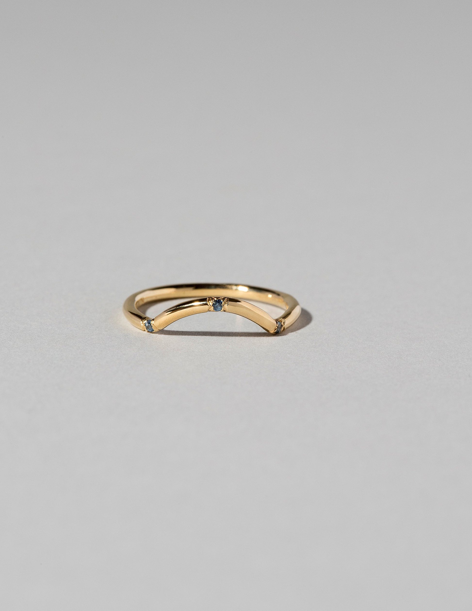 Mini Curve Band - Three Stone on light color background.