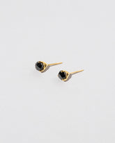 Martini Studs - Black Diamond on light color background.