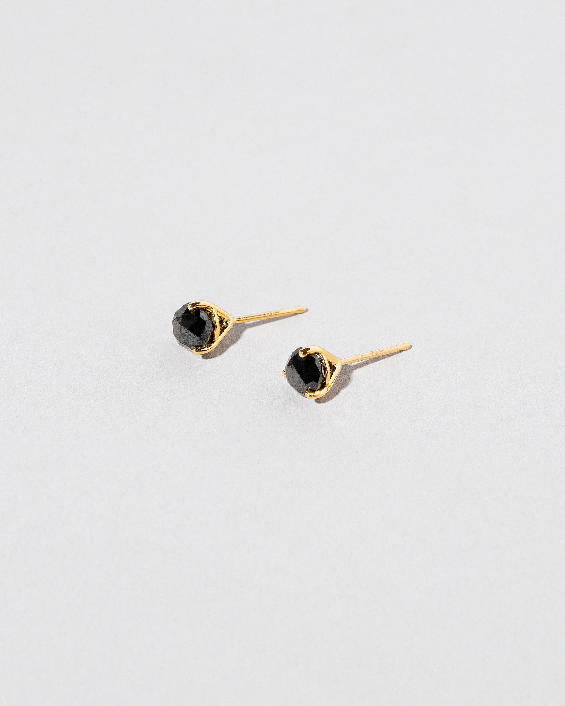 Martini Studs - Black Diamond on light color background.