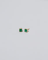 Square Stud - Emerald on light color background.