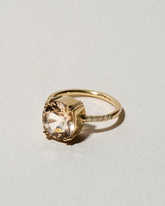 View from the side of the Morganite Solitaire Ring on light color background.