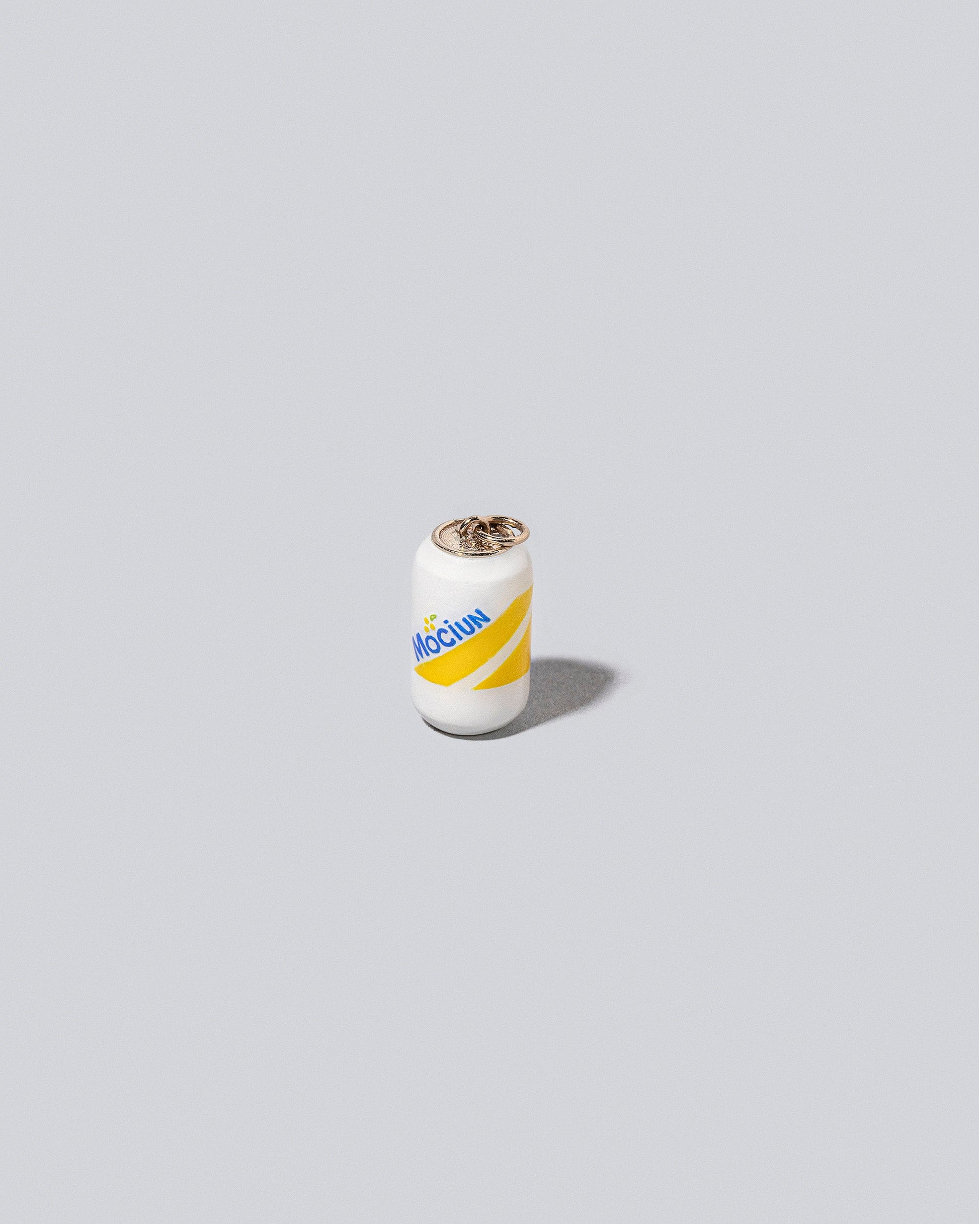 Mociun Soda Charm on light color background.