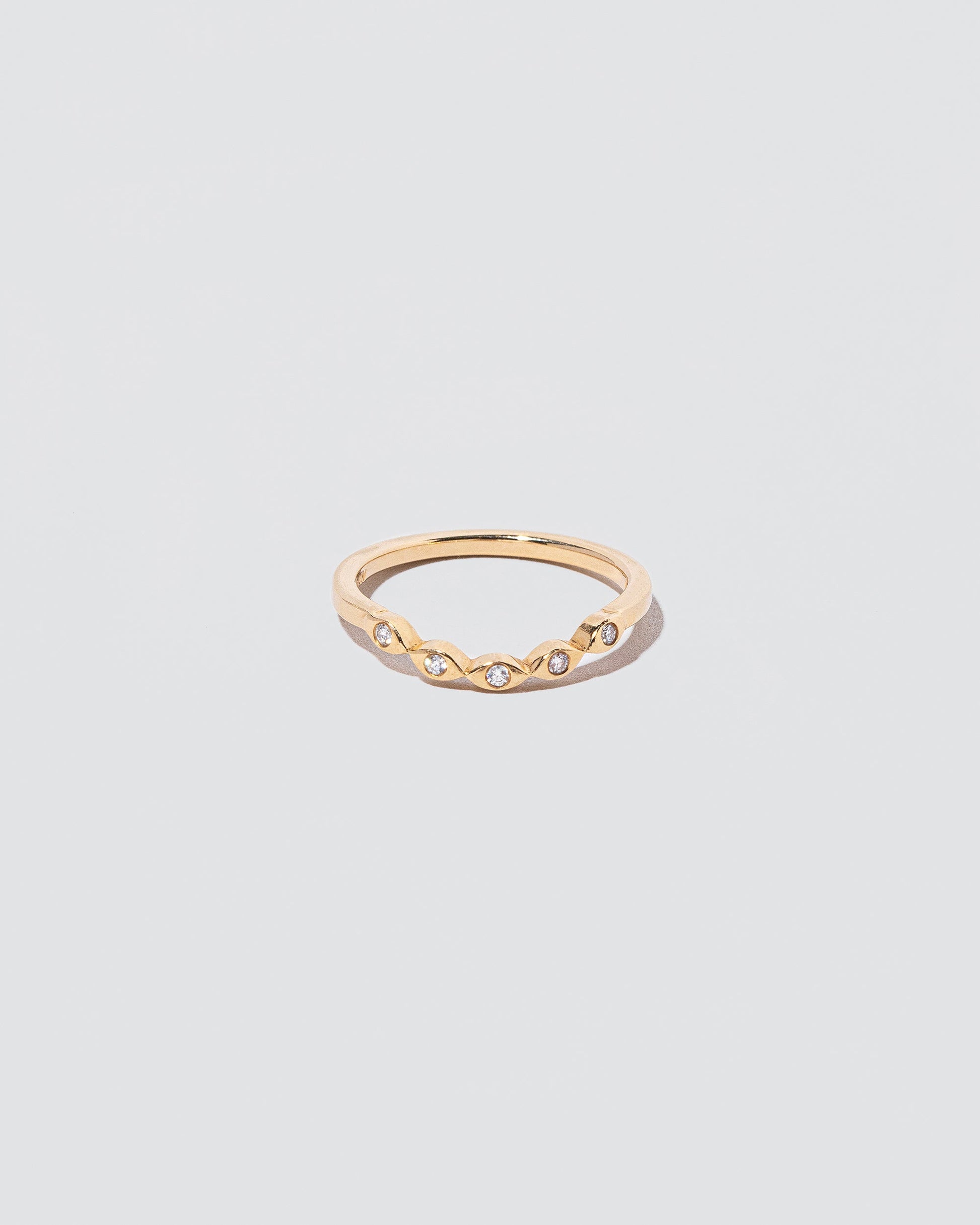 Gold Seeing Eye Band on light color background.