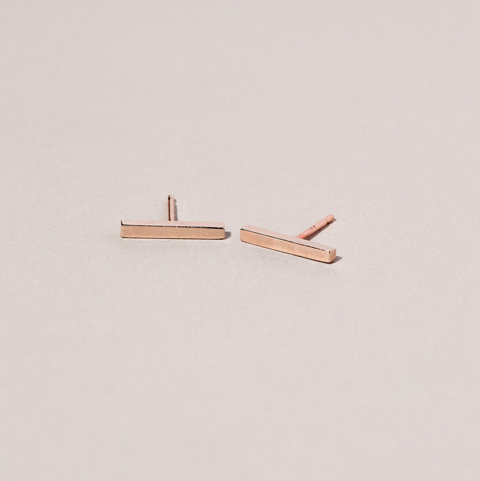 product_details:: Stick Studs on light color background.