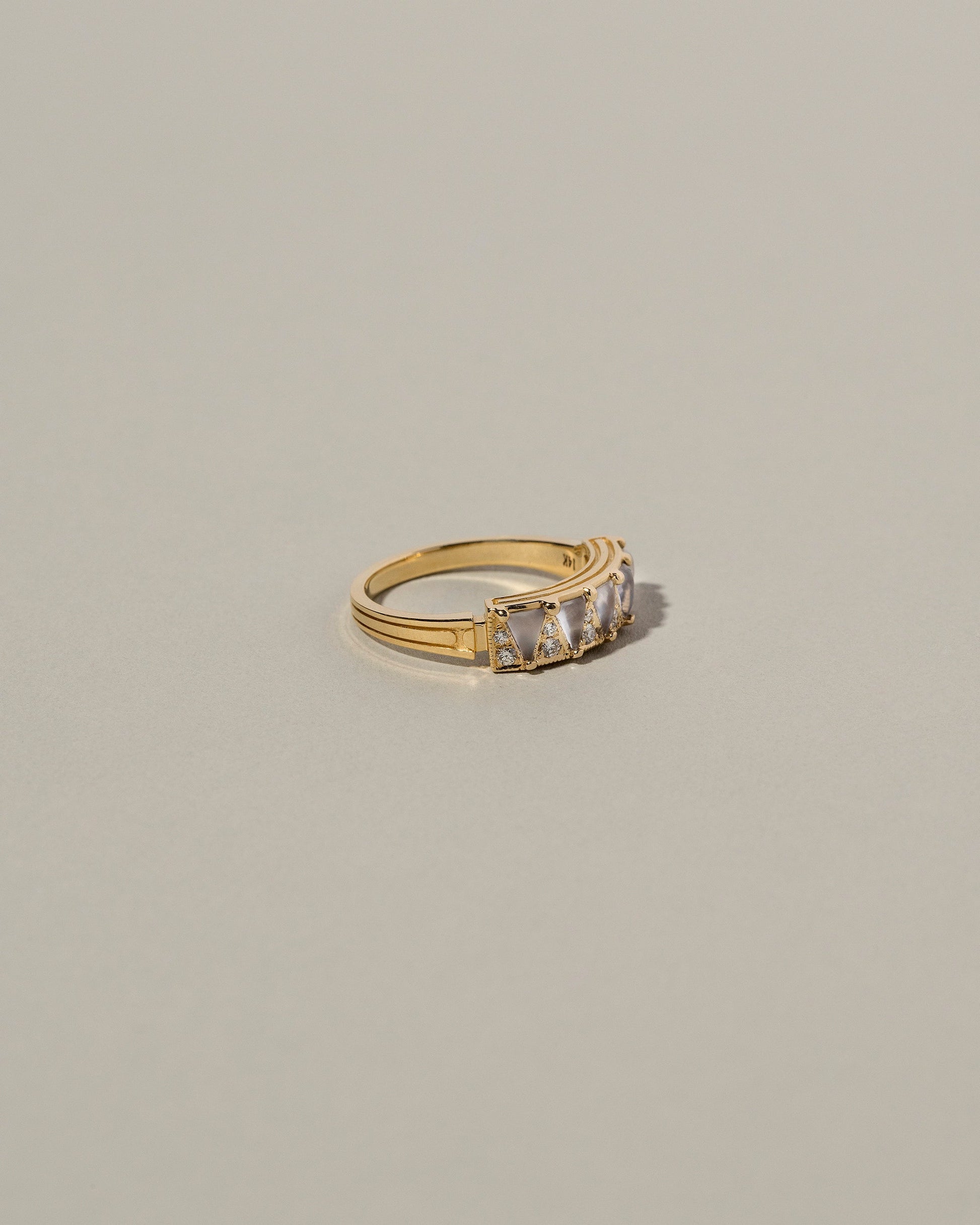 Five Triangle Ring - Blue Chalcedony on light color background.