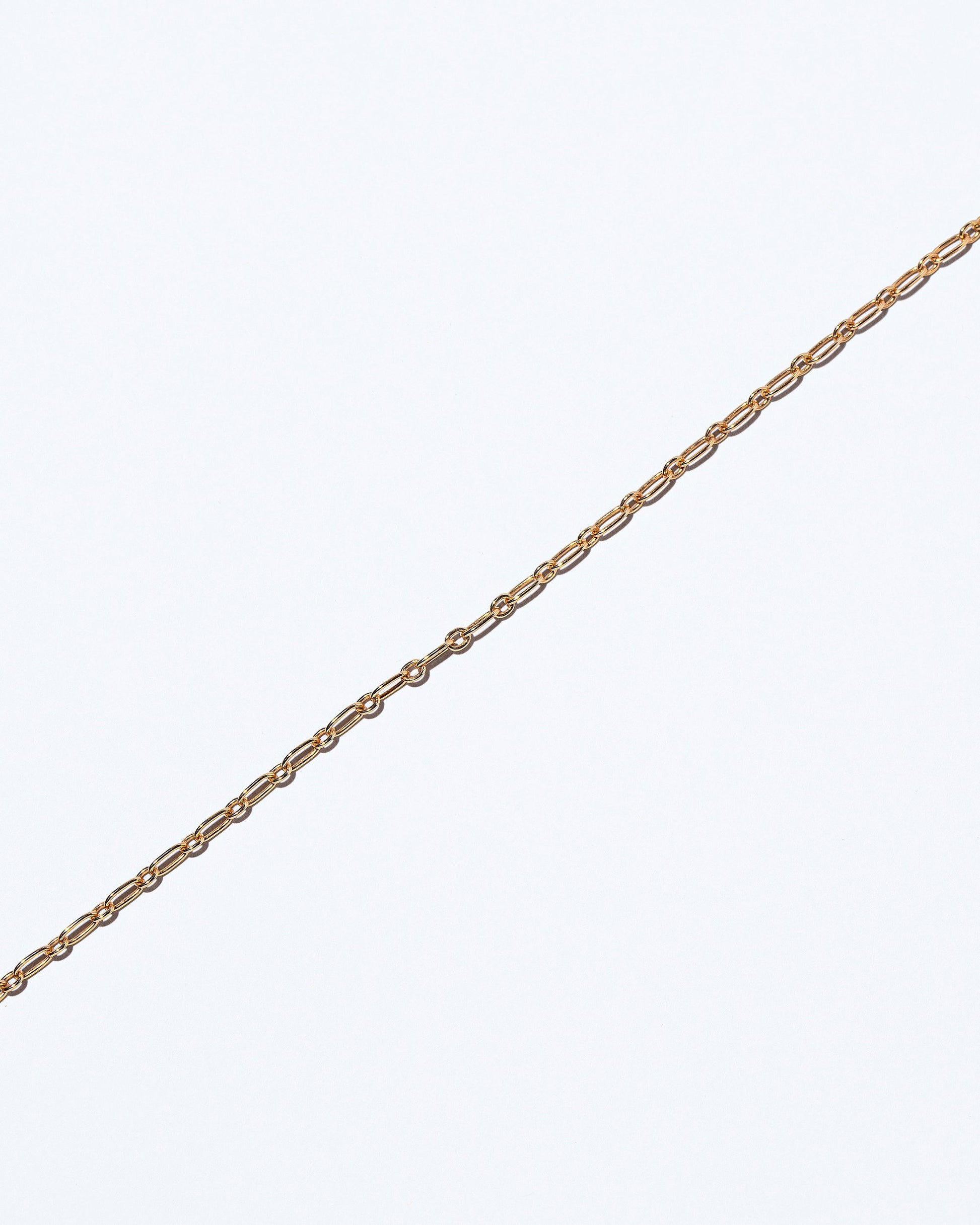 Hotdog Chain Bracelet on light color background.