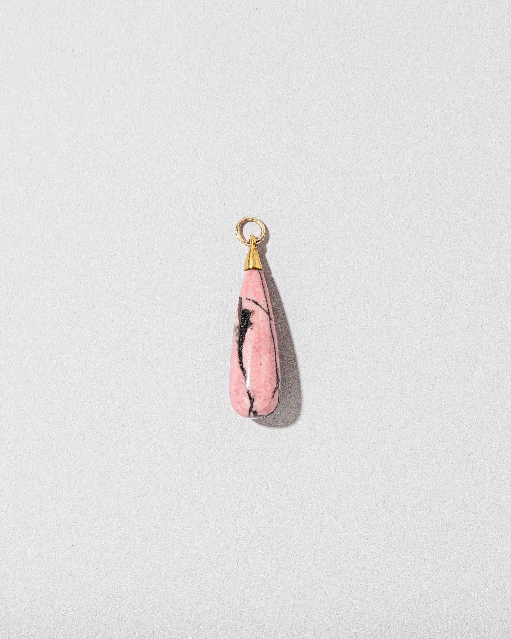 Rhodolite Drop Pendant on light color background.