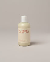 Sisters Body Nourishing Conditioner on light color background.