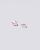 Lagniappe Pearl Stud Earrings on light color background.
